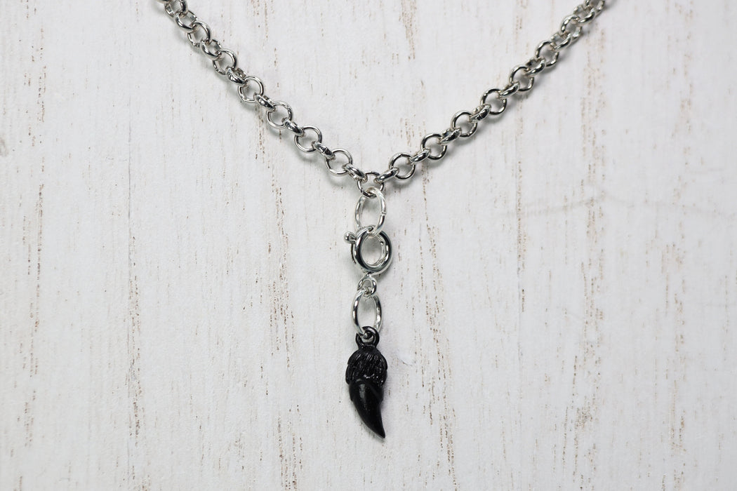 Traveler's Trinkets: Dragon Fang Charm